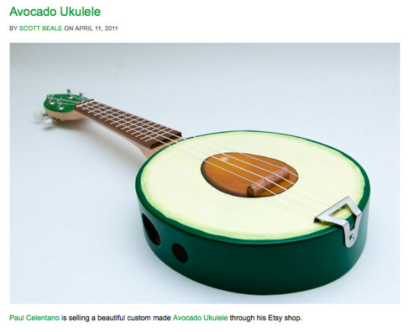 A Ukulele shaped like an avocado.